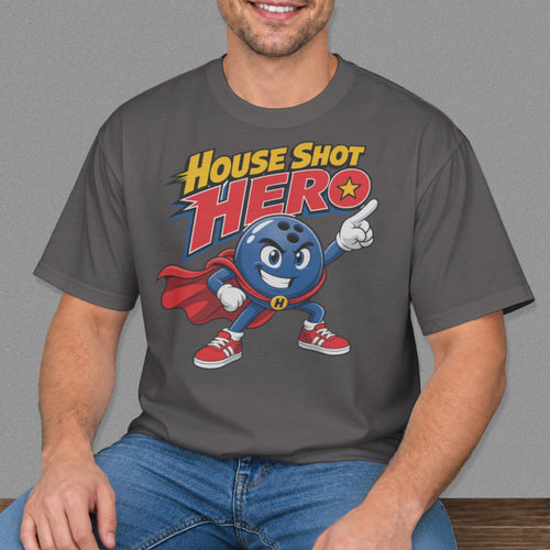 A man wears a gray t-shirt featuring a cartoon bowling ball superhero graphic and text that reads House Shot Hero.